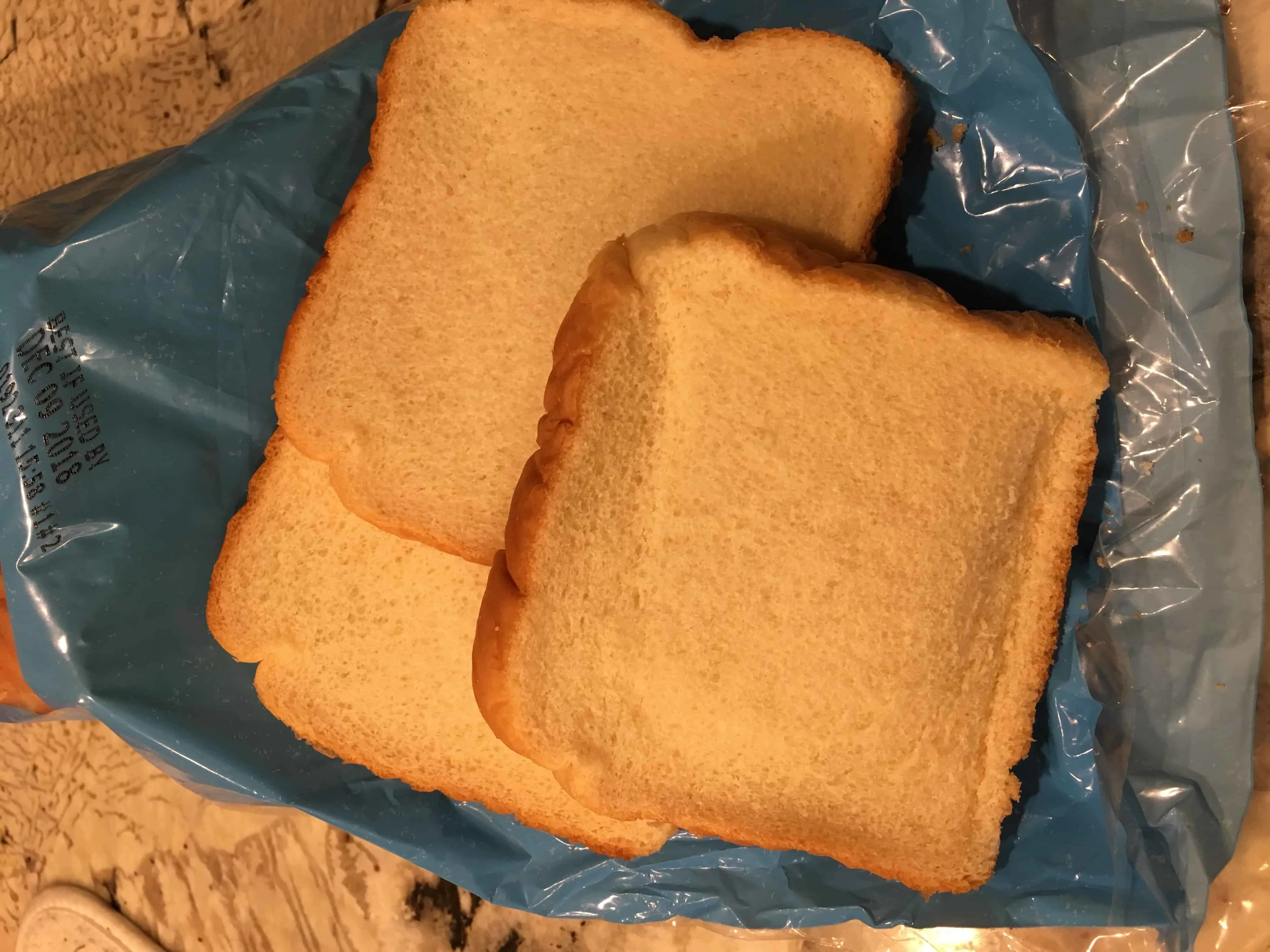 sandwich bread sitting on top of a bag